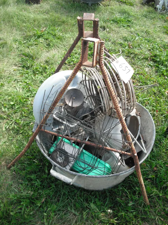 galvanized pail with décor items and rebar brackets