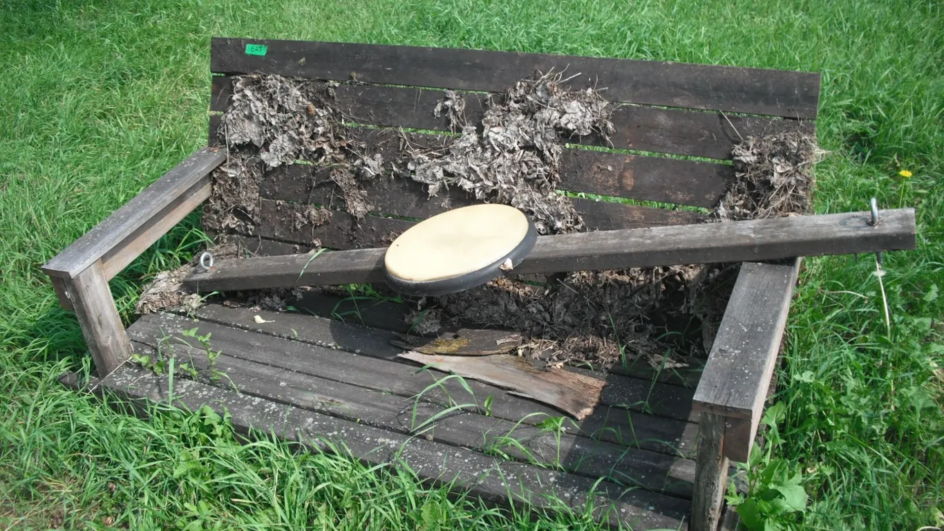 vintage wooden bench with deer thermometer