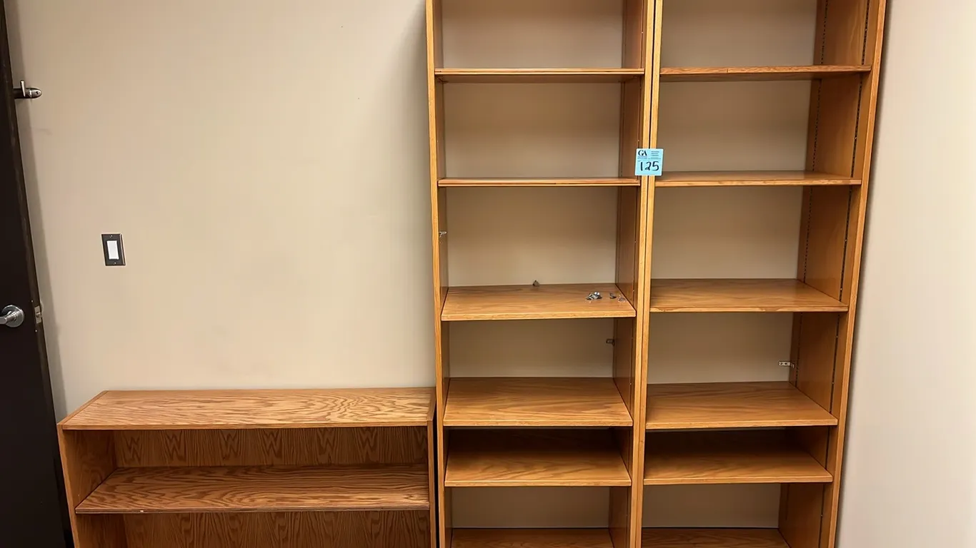 3 Bookcases, lower one is 48”x12”x26.5”, and 2 are 25”x16”x84”