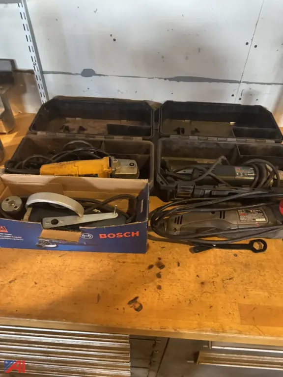 (4) Electric Grinders (two with Tool Container) and an Electric Sawzall