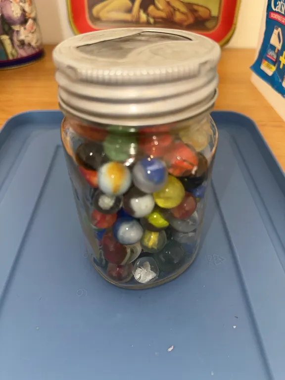 Vintage marbles in jar