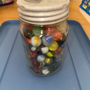 Vintage marbles in jar