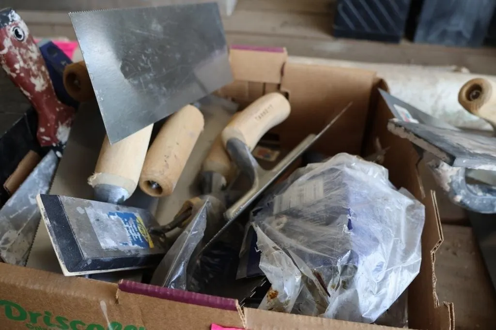 Box of new trowels and old bank box
