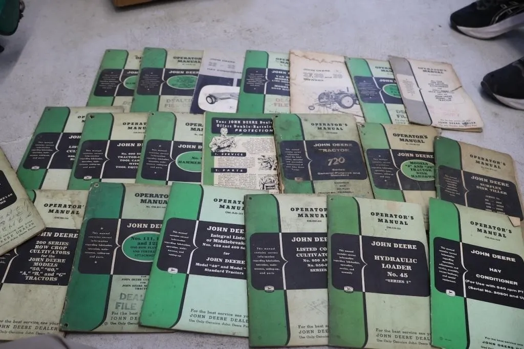 Box of John Deere operator and dealers manuals