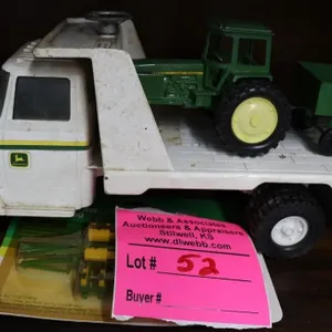 John Deere flatbed equipment truck with
