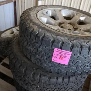 Four RAM alloy wheels with 275/60R20 tires