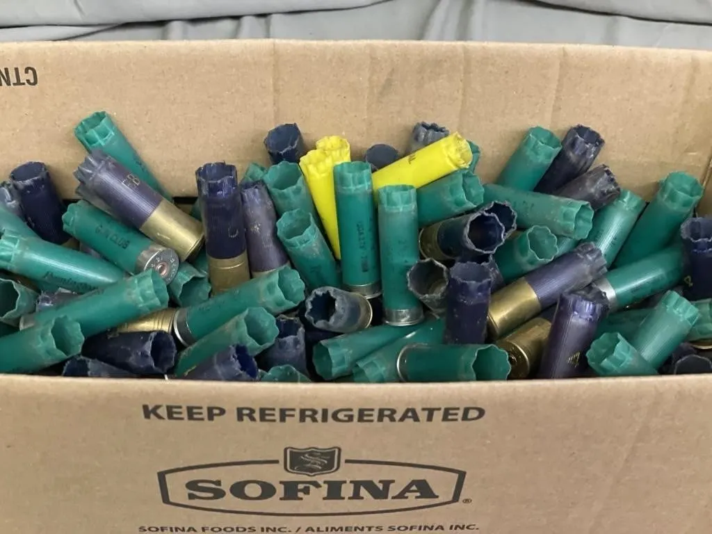 Box full of primed 12 ga. shotgun hulls. Box is