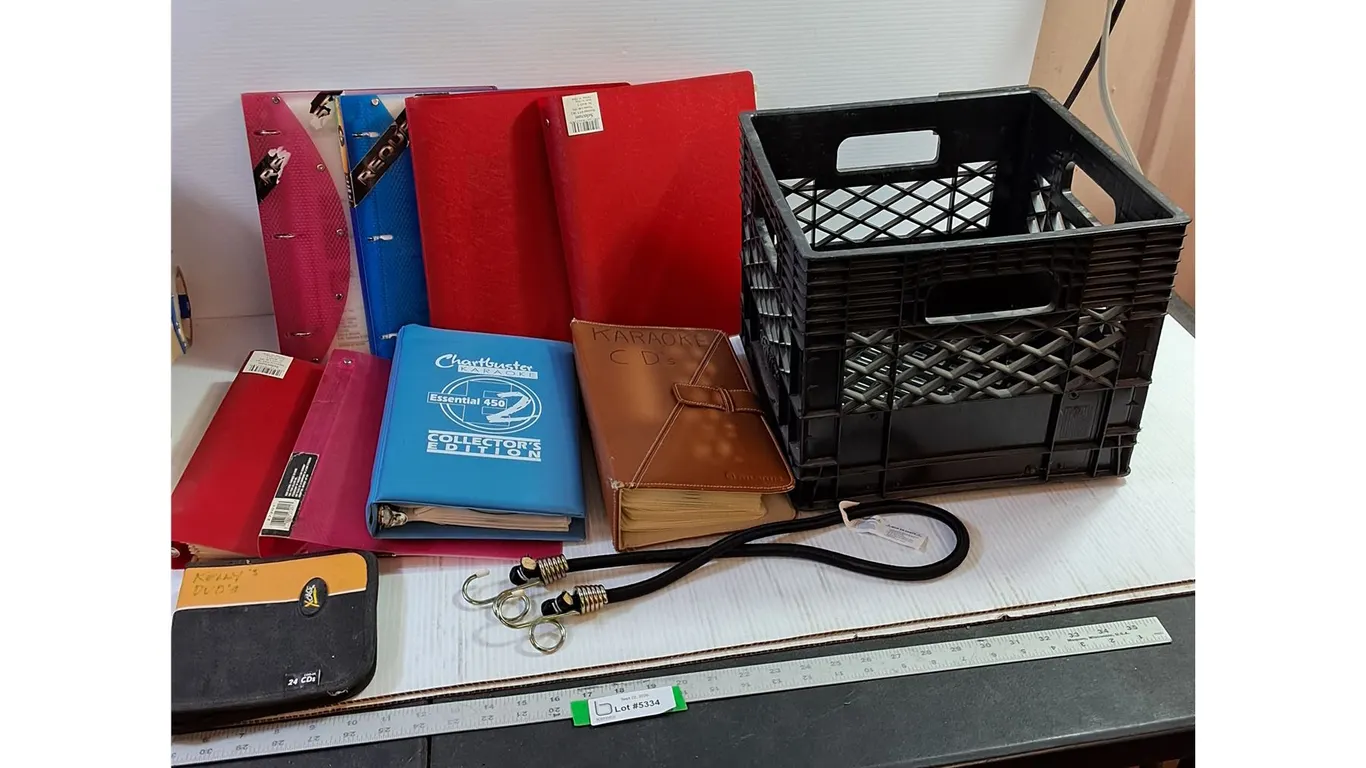 Assorted Binders, Karaoke CDs, DVD Case, Bungee Cord, Milk Crate