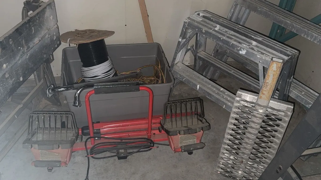 Construction Equipment Including LED Work Lights, Workbench, Ladders, and Electrical Supplies
