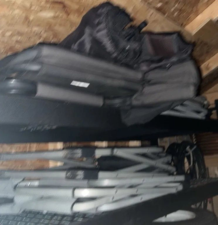 Folding Metal Chairs and Carry Bags on Metal Storage Shelving