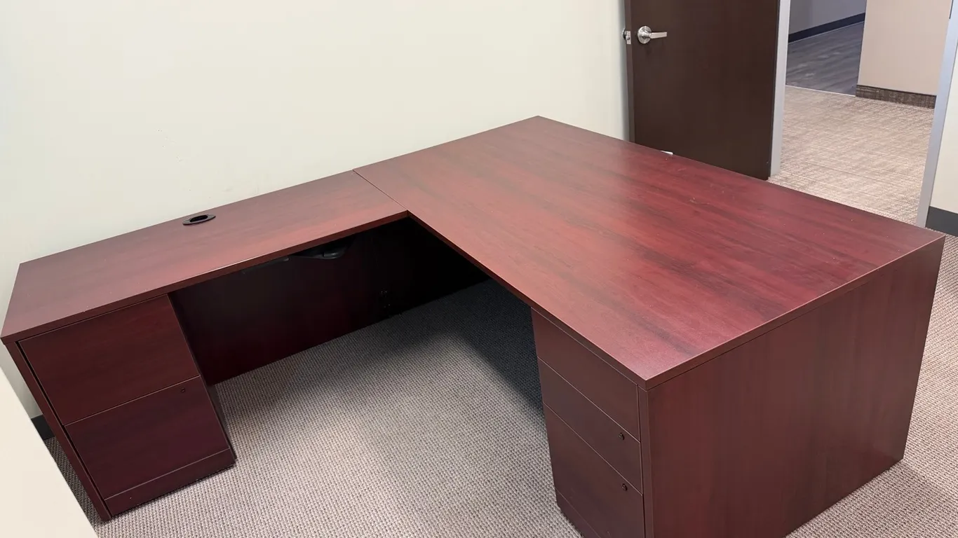 L-Shaped Executive Office Desk, 2 pedestal drawers, mahogany finish. 6’ long main section with 4’ wing