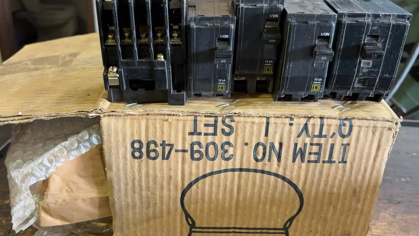Square D Circuit Breaker Assortment Including 20A, 60A & 100A Breakers with Disconnect Block