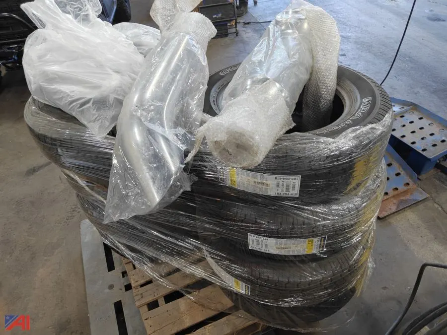 Pallet of Tires, Exhaust Stacks and Headlights, New/Old Stock