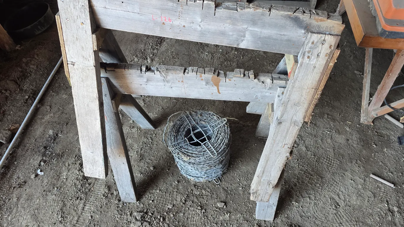 Wooden Saw Horses and Barbed Wire