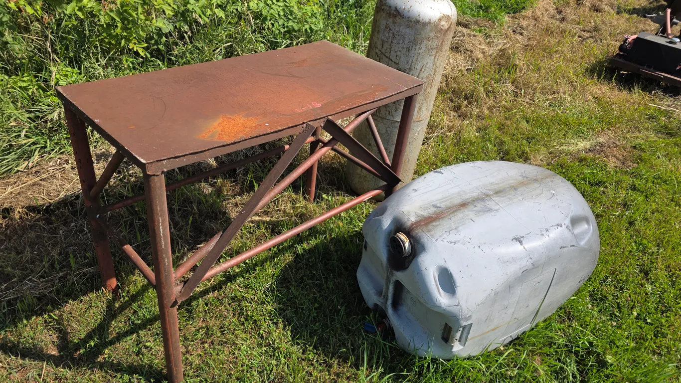 22” x 44” x 36” Metal Work Bench, 100lb Propane Cylinder (Old Style) and Plastic Barrel