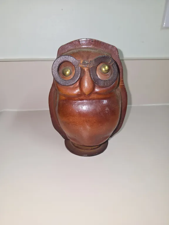 Vintage all leather piggy bank with brass eyes