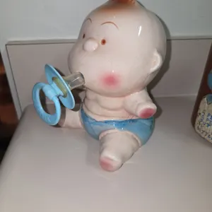 Vintage piggy bank, adorable baby and pacifier on small potty, ceramic, funny, children's room decor