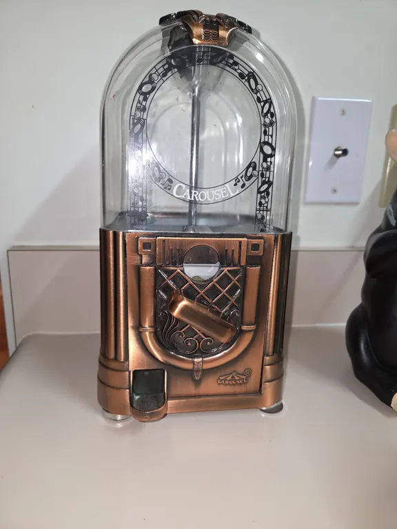 Vintage carousel, copper and glass gumball machine.