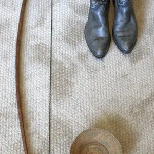 Cowboy Boots, Woven Basket, and Marked Longbow