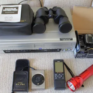 Electronics and Optics Bundle Including SV2000 DVD Recorder, Canon ELPH, Garmin GPS, and Simmons Bin