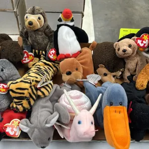 A Collection of Ty Original Beanie Babies. (Ty, 1990s) A collection of plush Beanie Babies including Peace, Fuzz, Puffer, Lucky, Roam, and others, fea