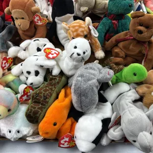 A Collection of Ty Beanie Babies. (Ty, 1990s) An assortment of original Beanie Babies plush toys featuring various animal designs, each retaining Ty h
