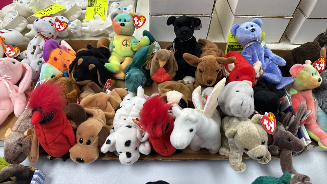 A Collection of Ty Beanie Babies Plush Toys. (Ty, 1990s-2000s) An assortment of 21 Ty Original Beanie Babies featuring Peace bear, Snort the bull, Dot