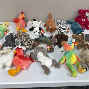 A Collection of Ty Original Beanie Babies. (Ty, 1990s) An assortment of plush figures including Strut the rooster, Peace bear, Magic dragon, Claude th