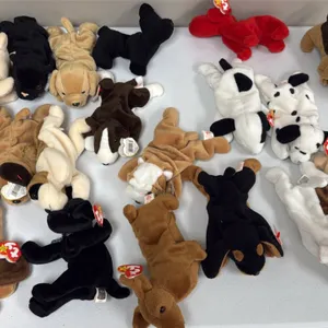 A Collection of Ty Original Beanie Babies Dogs. (Ty, 1990s) A collection of Ty Beanie Babies dog plush figures, including Butch, Rover, Spunky, Dotty,