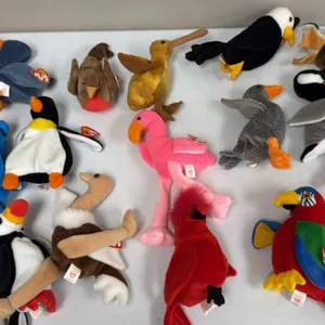 A Collection of Ty Original Beanie Babies Bird Plush Figures. (Ty, 1990s) A collection of 16 bird-themed Beanie Babies including Jabber the parrot, Pi
