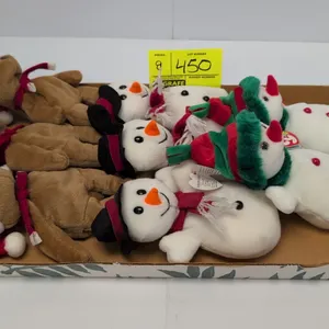 A Collection of Holiday Ty Beanie Babies. (Ty, 1997-2000) A group of 9 Ty Original Beanie Babies plush toys, including (3) 1997 Teddy bears with Santa