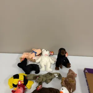 A Collection of Ty Original Beanie Babies. (Ty, 1990s) An assortment of (10) plush Beanie Babies including Strut the rooster, Halo the angel bear, Roa
