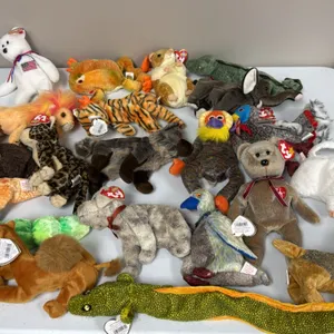 A Collection of Ty Beanie Babies. (Ty, 1990s-2000s) A collection of assorted Ty Beanie Babies plush figures, including Morrie the eel, 1999 Signature 