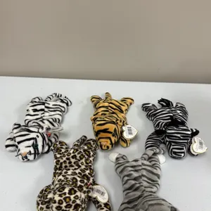 A Collection of Ty Beanie Babies Plush Toys. (Ty, 1990s) A five-piece collection of animal-print plush figures including a tiger, white tiger, zebra, 