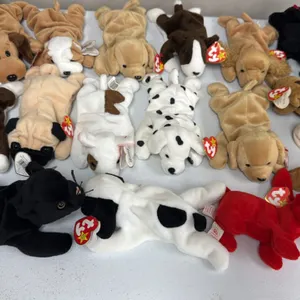 A Collection of Ty Beanie Babies Dog Plush Toys. (Ty, 1990s) An assortment of plush beanbag figures, primarily depicting various dog breeds including 