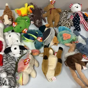 A Collection of Ty Original Beanie Babies. (Ty, 1990s) A collection of assorted plush figures including Iggy the iguana, Baldy the eagle, Stretch the 