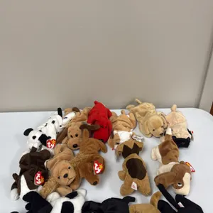 A Collection of Ty Original Beanie Babies Dogs. (Ty, 1990s) A collection of 16 Ty Beanie Babies plush dog figures, including Spot, Dotty, Wrinkles, an