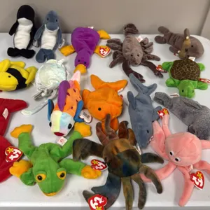 A Collection of Ty Beanie Babies. (Ty, 1990s) A collection of 16 assorted aquatic-themed plush figures including Pinchers the lobster, Claude the crab