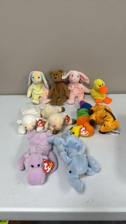 A Collection of Ty Original Beanie Babies. (Ty, 1990s) An assortment of ten plush Beanie Babies including Happy the hippo, Peanut the elephant, Inch t