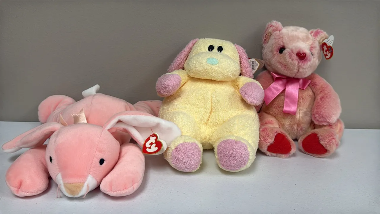 A Collection of Ty Plush Toys. (Ty, 1990s-2000s) A lot of three Ty plush toys including two Pillow Pals, "Carrots" the bunny and "Dogbaby" the dog, an