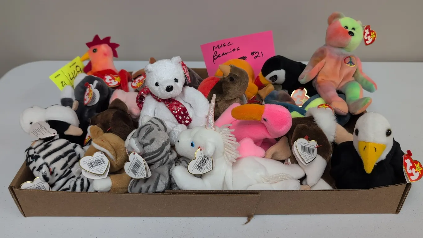 A Collection of Ty Original Beanie Babies. (Ty, 1990s) An assortment of Ty Beanie Babies plush animals, including Peace bear, Nip the cat, Baldy the e