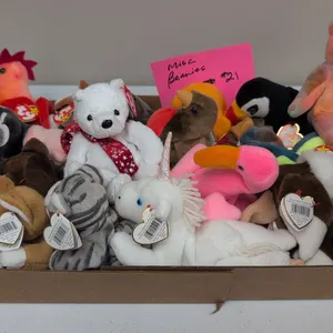 A Collection of Ty Original Beanie Babies. (Ty, 1990s) An assortment of Ty Beanie Babies plush animals, including Peace bear, Nip the cat, Baldy the e