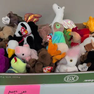 A Collection of Ty Original Beanie Babies. (Ty, 1990s-2000s) An assortment of original Ty Beanie Babies plush animals, including Millennium bear, Fort