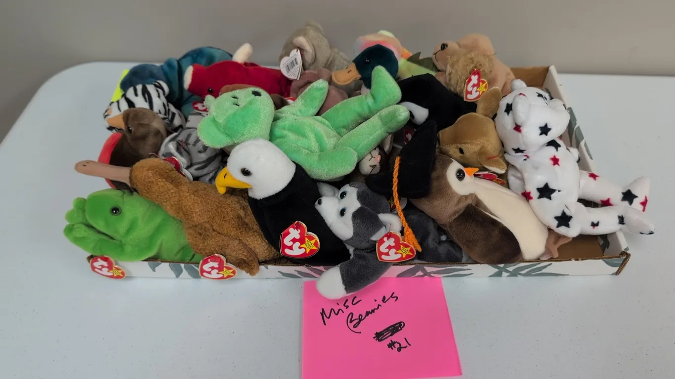 A Collection of Ty Beanie Babies. (Ty, 1990s) An assortment of 21 Ty Original Beanie Babies plush animals, including Blizzard the tiger, Wise the owl,