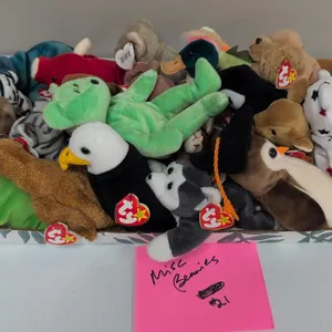 A Collection of Ty Beanie Babies. (Ty, 1990s) An assortment of 21 Ty Original Beanie Babies plush animals, including Blizzard the tiger, Wise the owl,