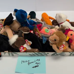 A Collection of Ty Beanie Babies. (Ty, 1990s) A collection of 21 assorted Ty Original Beanie Babies plush toys, including Iggy, Clubby, Claude, Batty,