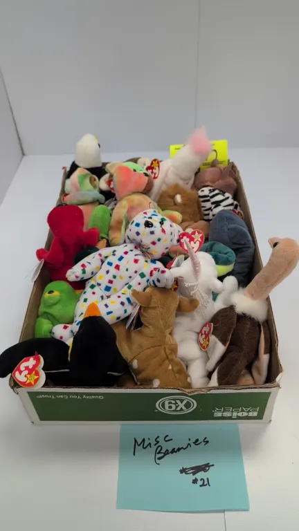 A Collection of Ty Original Beanie Babies. (Ty Inc., 1990s) An assortment of plush beanbag toys featuring Mystic the unicorn, Peace the bear, Claude t