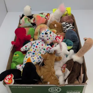 A Collection of Ty Original Beanie Babies. (Ty Inc., 1990s) An assortment of plush beanbag toys featuring Mystic the unicorn, Peace the bear, Claude t