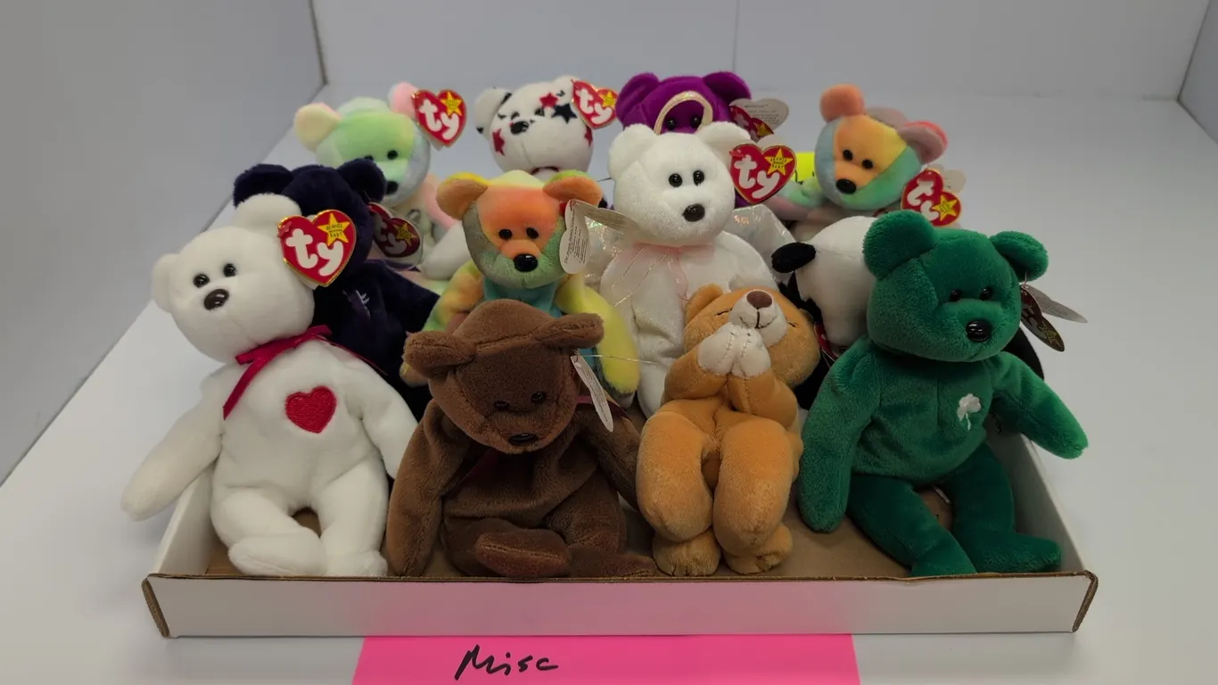 A Collection of Ty Beanie Babies Bears. (Ty, 1990s-2000s) An assortment of 12 plush bear figures, including Valentino, Erin, Halo, and Peace, each ret