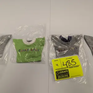 A Collection of Ty Original Beanie Babies T-Shirts. (Ty, 1990s) A set of four miniature plush t-shirts featuring embroidered lettering, including 'BEA